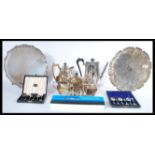 A collection of silver plated items to include salver trays, coffee pot, tea service, presentation