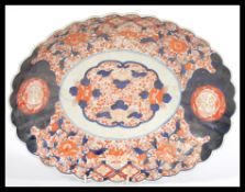 A Qing Dynasty late 19th Century Japanese scalloped shaped ceramic Imari dish / charger.