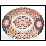 A Qing Dynasty late 19th Century Japanese scalloped shaped ceramic Imari dish / charger.