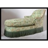 A good early 20th century French chaise longue / day bed of tub form being in the manner of Howard &