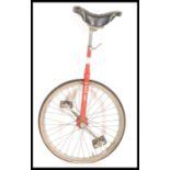 A vintage retro 20th century unicycle bicycle by Pashley having a red painted finish with adjustable