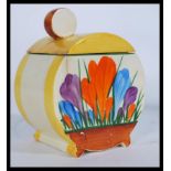 An early 20th century Clarice Cliff Bizarre Bonjour shape lidded condiment pot hand painted in the