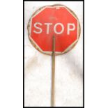 A vintage industrial 20th century stop and go lollipop sign with green and red panels. Measures: