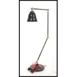 A large vintage retro floor standing anglepoise lamp having a black enamel finish with red enamel