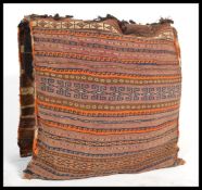 A pair of late 19th century North African wool and camel hair camel saddle bags woven with geometric