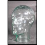 A 20th century moulded pressed glass phrenology type head - shop display stand / millinery mannequin