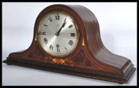 An early 20th Century Edwardian Hamburg America Company HAC inlaid mantle clock set within a