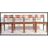 A retro mid century teak wood set of  Nathan dining room  chairs with pierced railed back rests