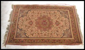An early to mid 20th Century Persian - Islamic style floor rug, large central medallion with