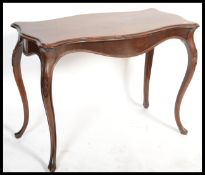A 19th century walnut biedemeier console table. Of continental origin raised on serpentine legs