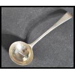 An 18th century silver hallmarked sauce ladle in the reverse Hanoverian pattern. Believed by