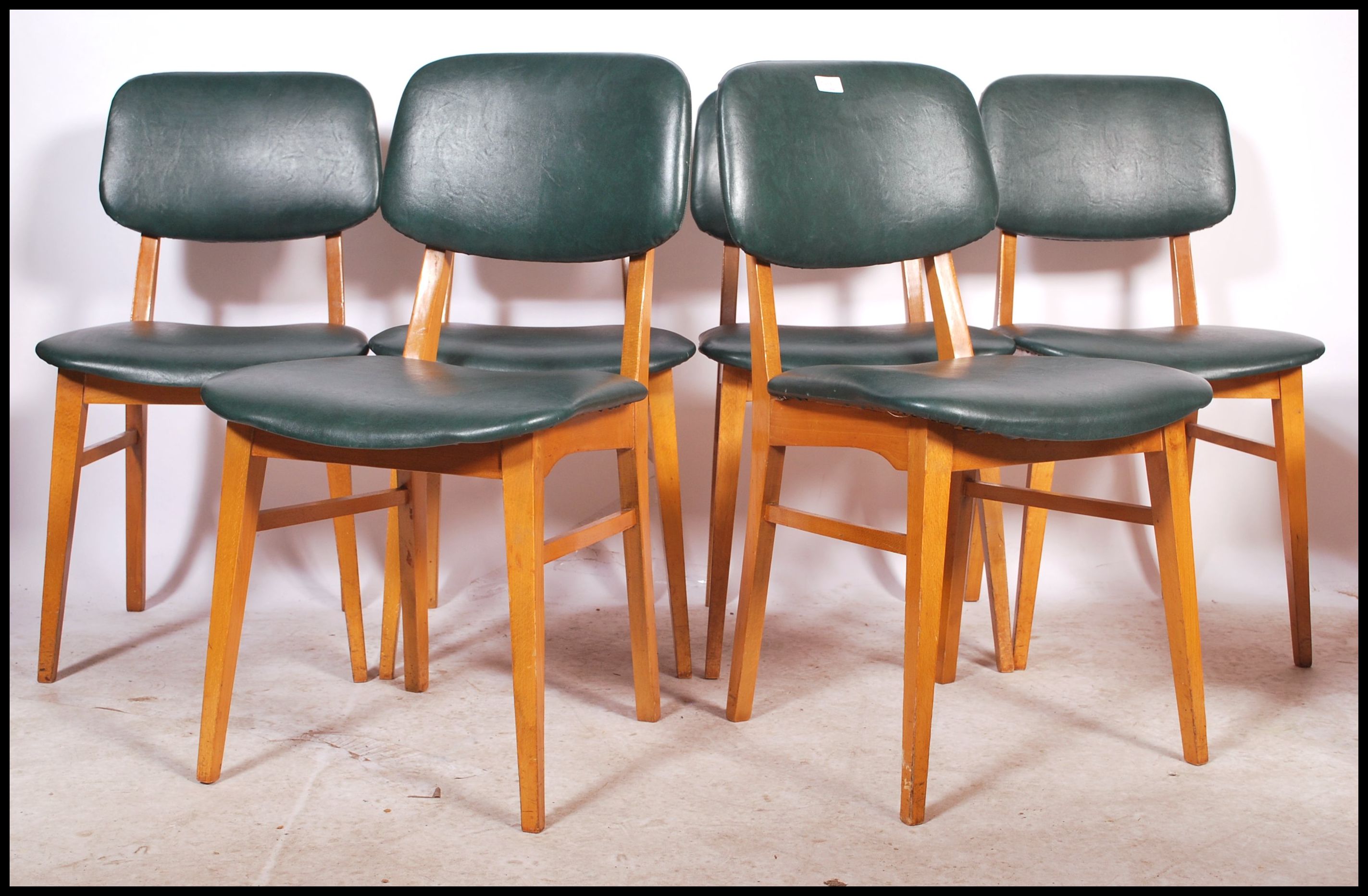A set of 14 retro dinette utility style dining chairs / cafe chairs each with green padded seats and
