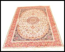 A large Iranian / Persian Keshan carpet - rug having beige ground with geometric decoration and