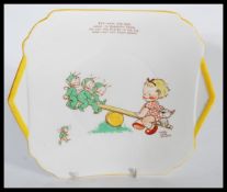 An early 20th century Art Deco ceramic Shelley Mabel Lucie Attwell plate depicting a girl and dog on