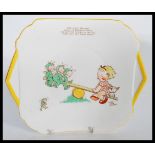 An early 20th century Art Deco ceramic Shelley Mabel Lucie Attwell plate depicting a girl and dog on