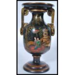 An early 20th century Chinese / Chinoserie black lacquered vase raised on a stepped circular base