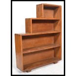 A 1930's Art Deco oak step bookcase. Solid oak wit