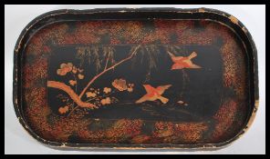 An early 20th century Japanese papier mache black lacquered chinoserie decorated tray. Gallery edges