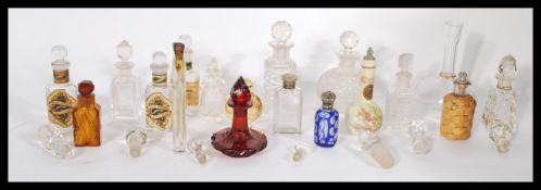 A collection of 19th and 20th Century perfume bottles to include a stunning Cranberry glass Bohemian