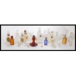 A collection of 19th and 20th Century perfume bottles to include a stunning Cranberry glass Bohemian