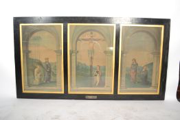 A large early 20th century framed and glazed triptych print of religious scenes bearing the original
