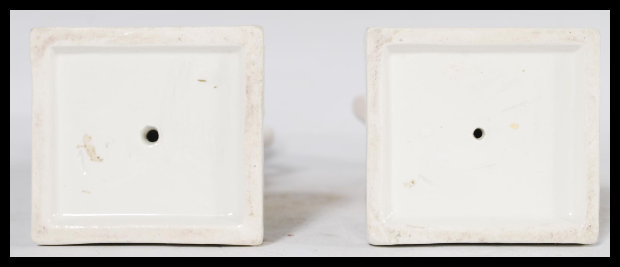 A pair of 19th century Staffordshire figural candlestick holders raised on square bases in the - Image 6 of 6