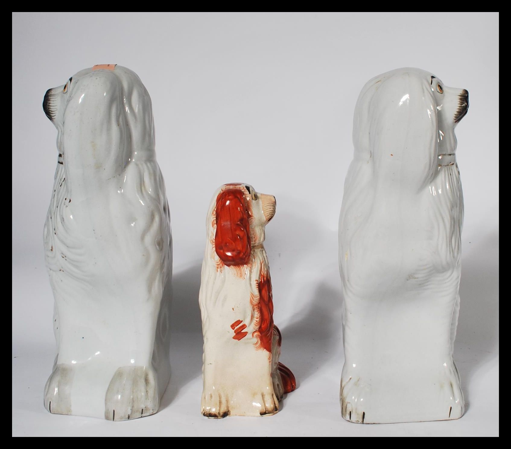 A pair of large Staffordshire 19th Century fireside dogs modelled as a pair of Spaniels together - Image 2 of 5