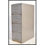 A mid century Industrial grey metal 3 drawer filing cabinet with pull handles and notation slides.