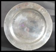 An 18th century Georgian large pewter charger tray by Thomas Wiltshire.  The plate of circular