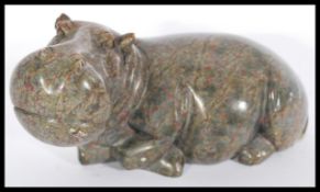 A vintage 20th century Inuit carved soapstone figurine of a hippo signed by artist l Chatsama to