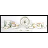 A good collection of Portmeirion botanic garden ceramics to include kitchen canisters, wall clock,