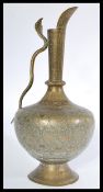 A 19th century Large Indian / Persian Islamic water jug of bulbous form having shaped handle and