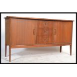 A good mid century / 1950's  sideboard by Pete Hayward for Vanson. The sideboard raised on shaped