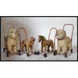 A good collection of vintage mid century childs ride on dogs together with 2 smaller push along