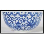 A 19th century Chinese porcelain blue and white bowl hand painted with scrolls and Ho Ho birds.