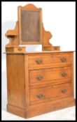 An Edwardian ash / oak dressing chest of drawers - table. Raised on a plinth base with a short and