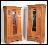 A near pair of 20th Century satin wood wardrobes, single mirrored doors to both over single deep