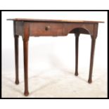 A 1930's Air Ministry George V stamped writing table desk being raised on turned tapering legs