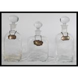 A group of three Glen Dartington Decanters designed by Frank Thrower all with silver hallmarked