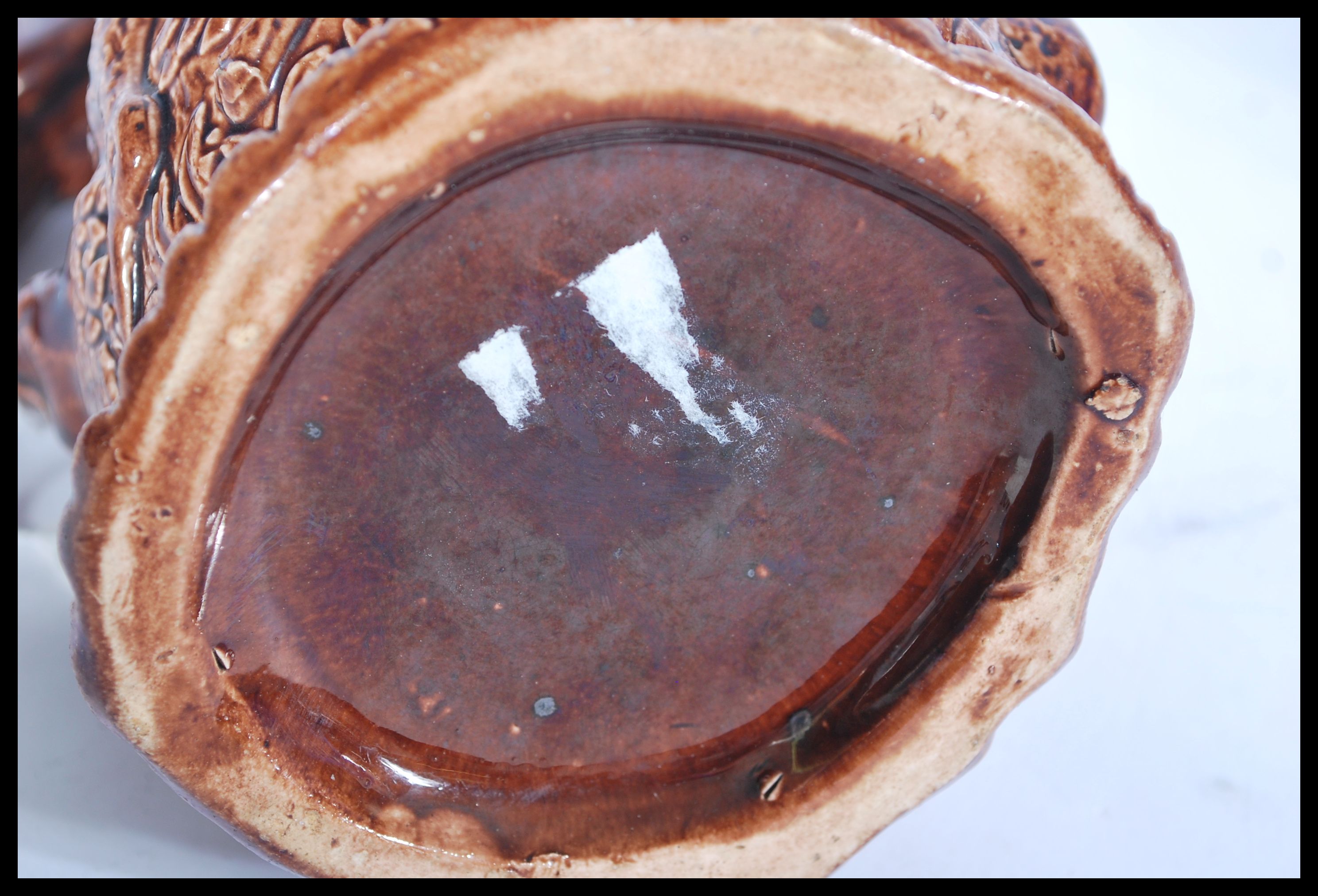 A 19th century Victorian relief jug depicting game featuring various animals with the handle in - Image 4 of 4