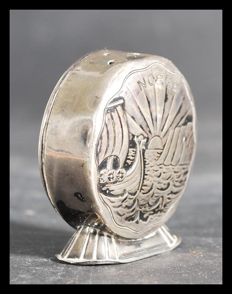 A Norway silver salt / pepperette of circular form with chased decoration of Viking longboats to - Image 2 of 6