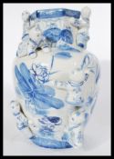 A Chinese large vase / jar having hand painted blue and white decoration depicting people with