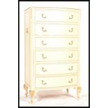 A 19th century style Louis style chest of drawers having an upright bow fronted bank of 6 drawers