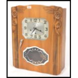 A French walnut Avron eight day wall clock, the rectangular dial with canted corners set with