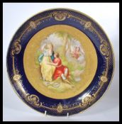 A Vienna circular cabinet plate, painted to centre with a study of Rinaldo & Armida and signed