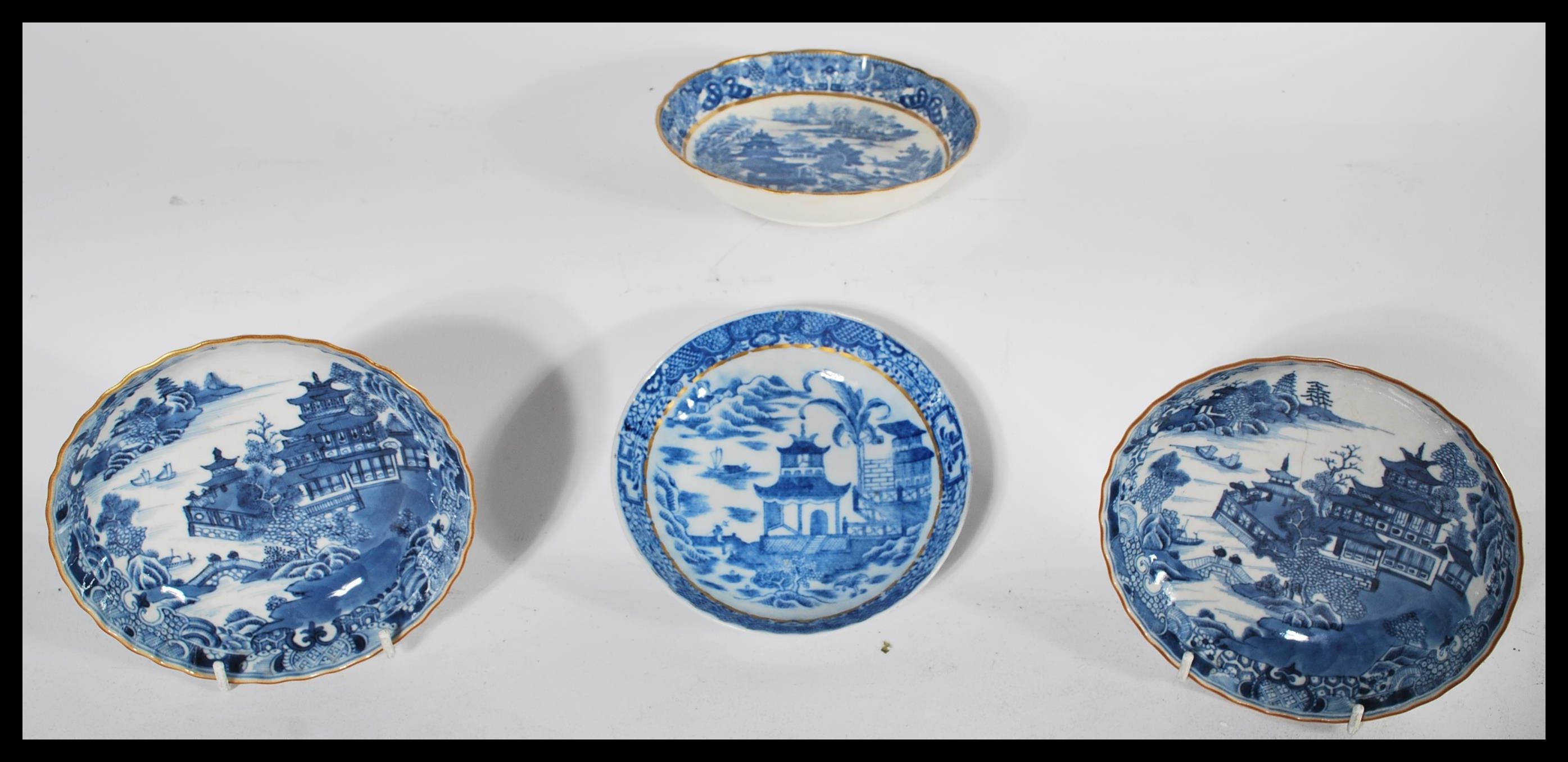 A group of four early English Factory most likely Worcester blue and white bowls / plates to include