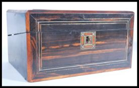 A 19th century coromandel wood writing slope box having a good shaped body with hinged top and