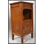 A French rouge marble topped bedside cabinet with one frieze drawer above a cupboard door on