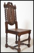 A Victorian 19th century oak barley twist carolean revival hall chair. Carved panel seat with