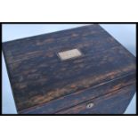 A 19th century coromandel workbox having hinged top with tooled leather and velvet lined top. The